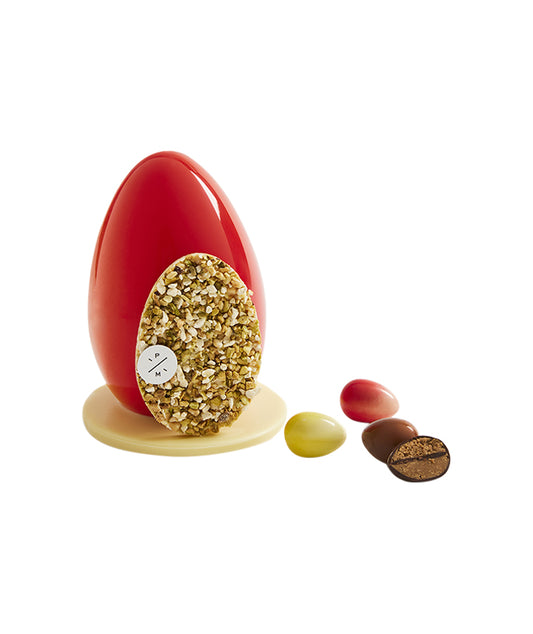Oeuf de Pâques au chocolat blanc, paré de fruits secs et rempli d'oeufs pralinés - Grand format